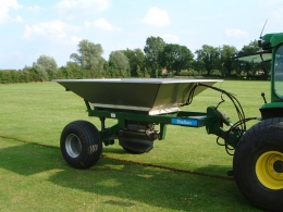 Shelton 3 tonne fast flow gravel hopper hitched to tractor side view