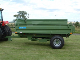 Shelton Hi Lift trailer hitched to tractor side view